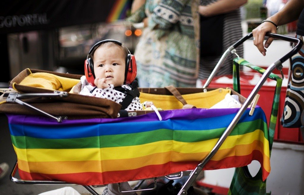 A child with ear-protection gear looks on during the HBTQ festival "Stockholm Pride" parade on August 6, 2011 in central Stockholm. AFP PHOTO / JONATHAN NACKSTRAND (Photo credit should read JONATHAN NACKSTRAND/AFP/Getty Images)